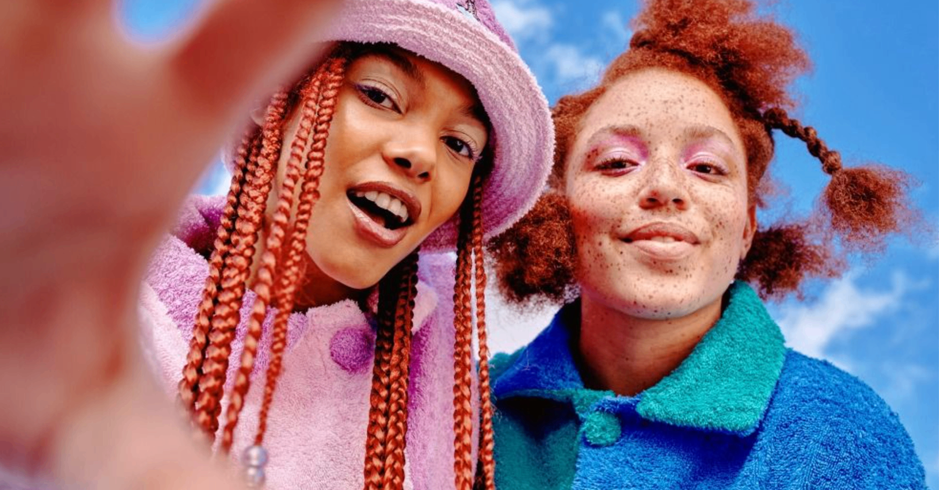 Two TikTok Shop creators together against a bright blue sky